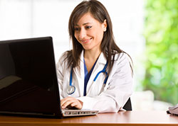 Healthcare Professional at her Computer